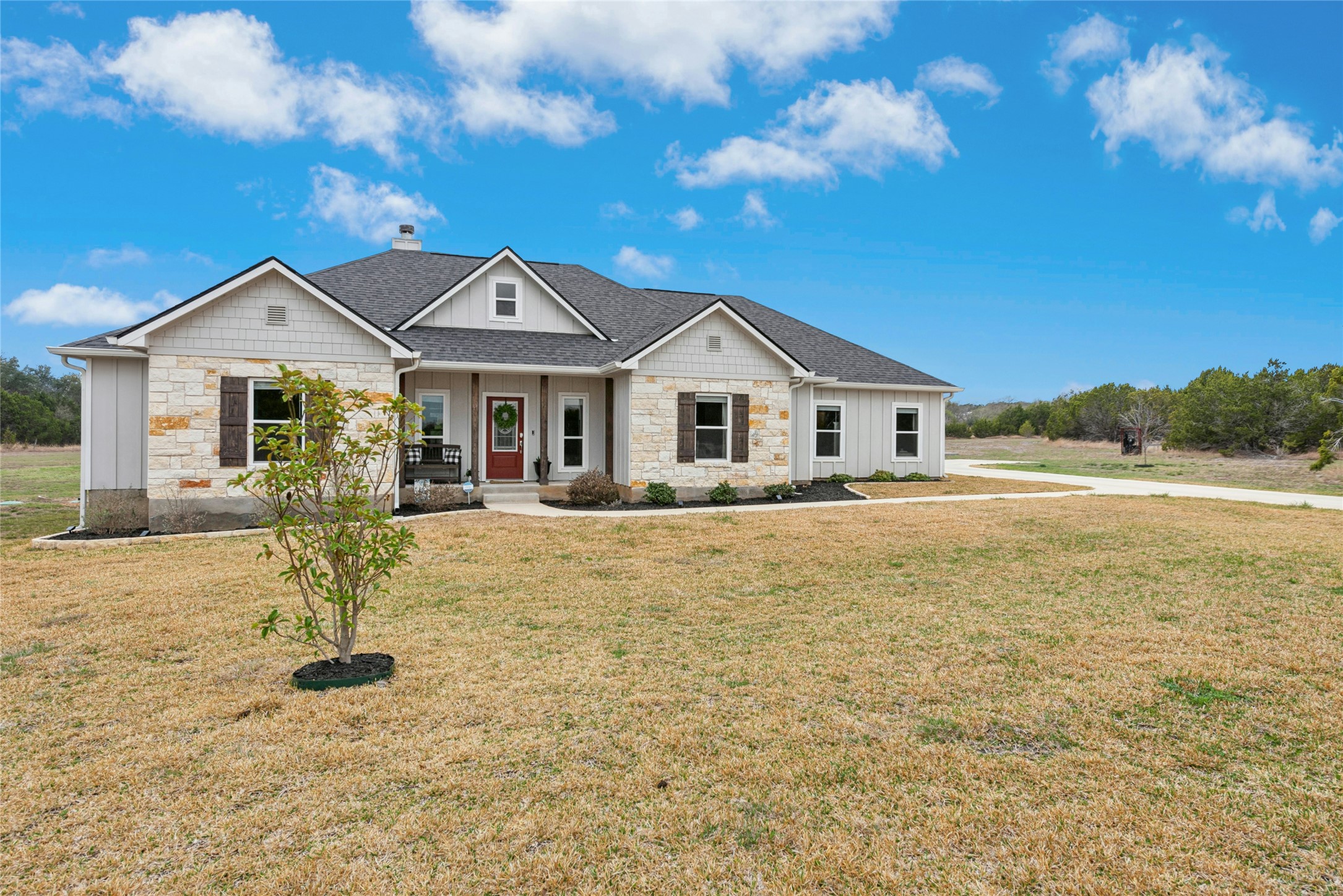 a front view of a house with a yard