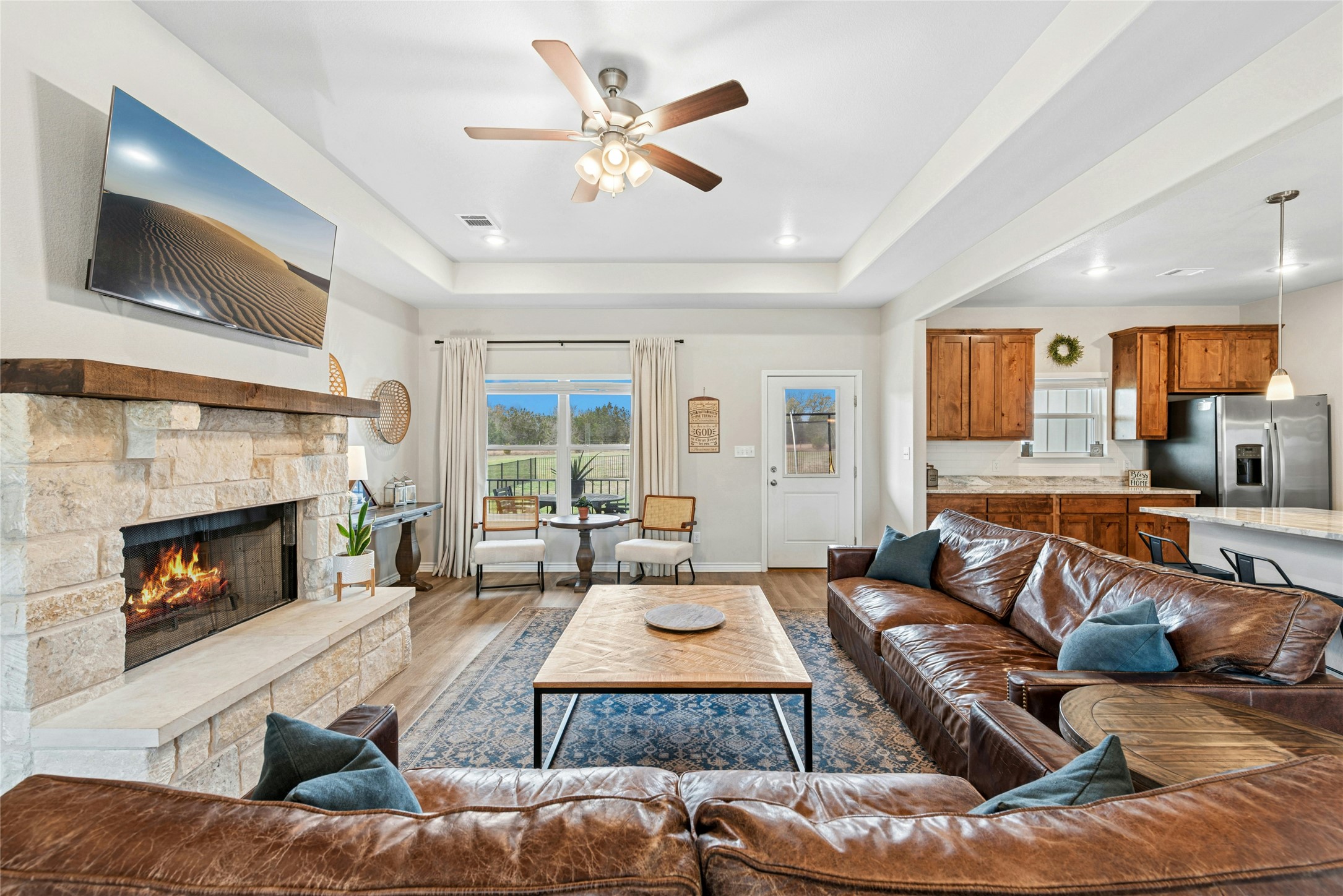 195 Rosebud Ranch Road Bertram, TX 78605 - Photo 11 of 40 a living room with furniture and a fireplace