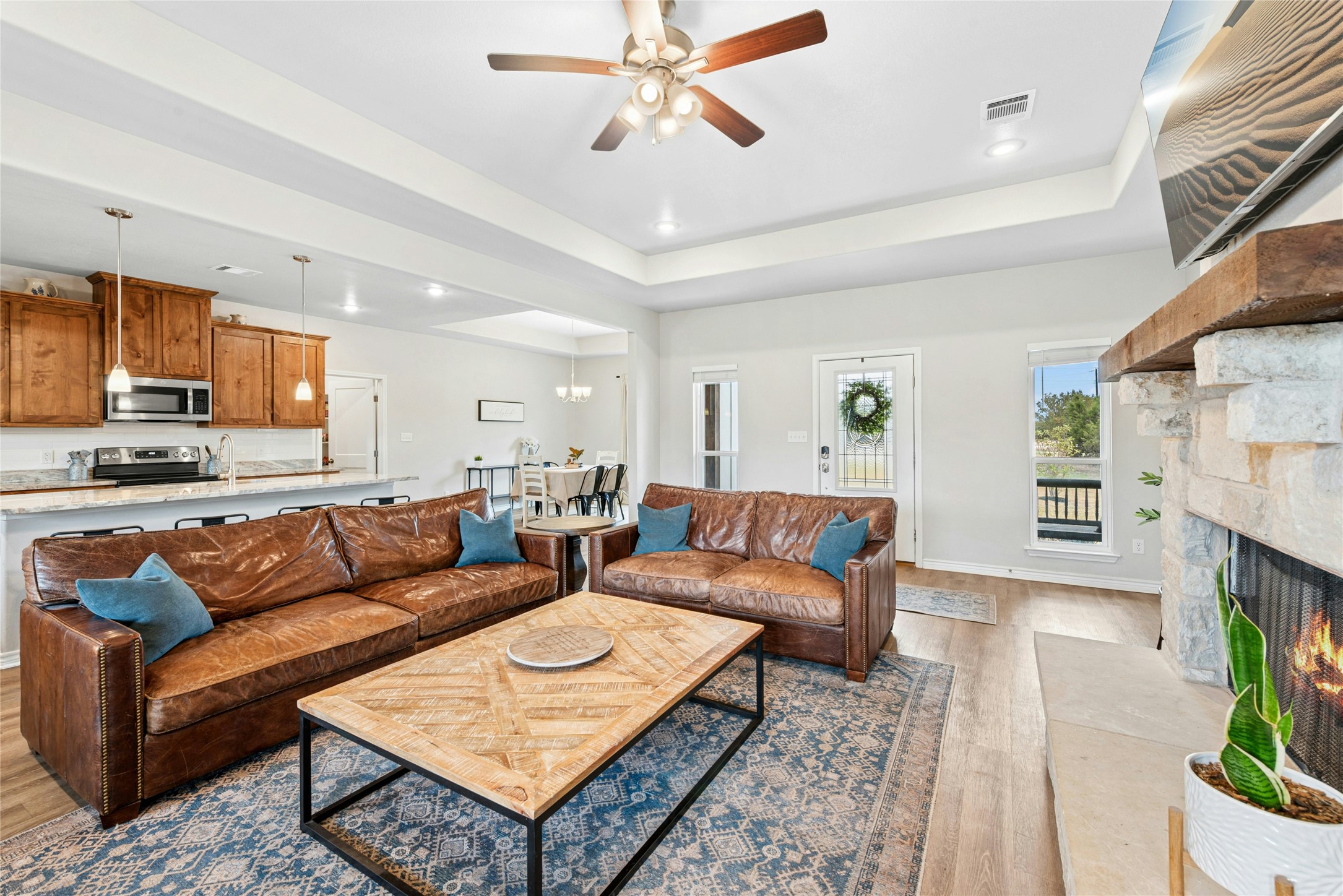 195 Rosebud Ranch Road Bertram, TX 78605 - Photo 12 of 40 a living room with furniture and a fireplace
