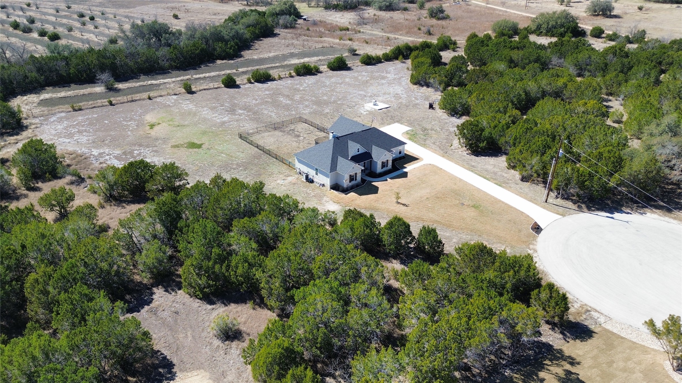 195 Rosebud Ranch Road Bertram, TX 78605 - Photo 2 of 40 an aerial view of a house with a yard