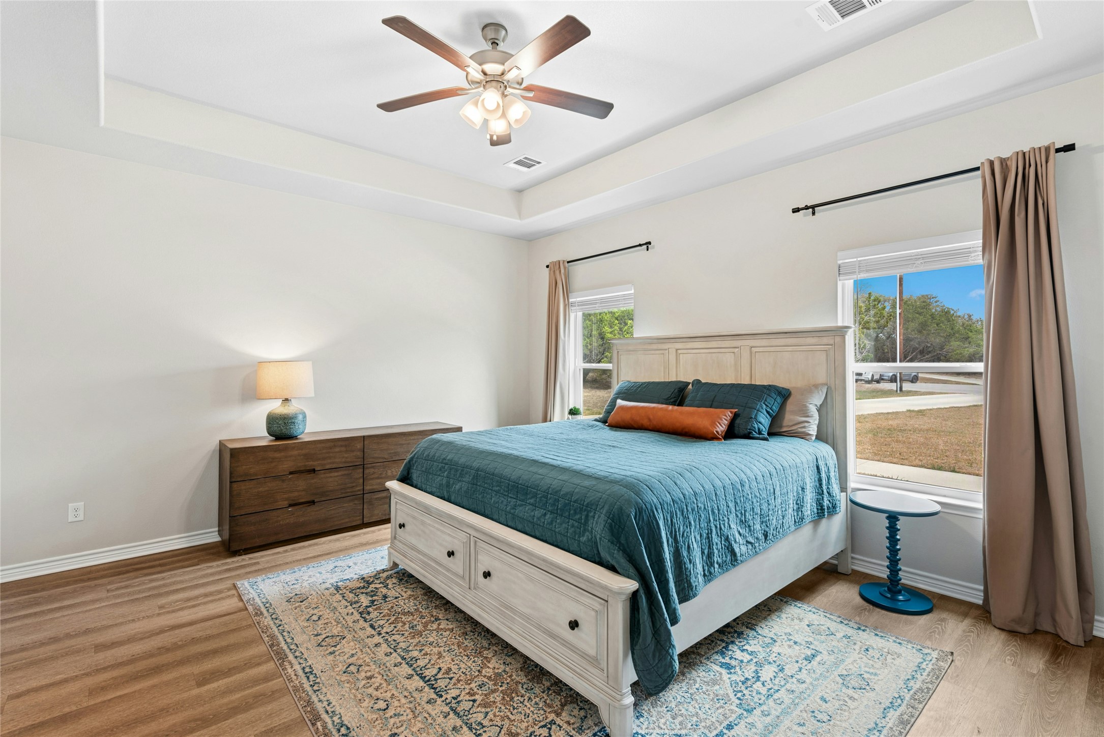 195 Rosebud Ranch Road Bertram, TX 78605 - Photo 21 of 40 a bedroom with a bed and window