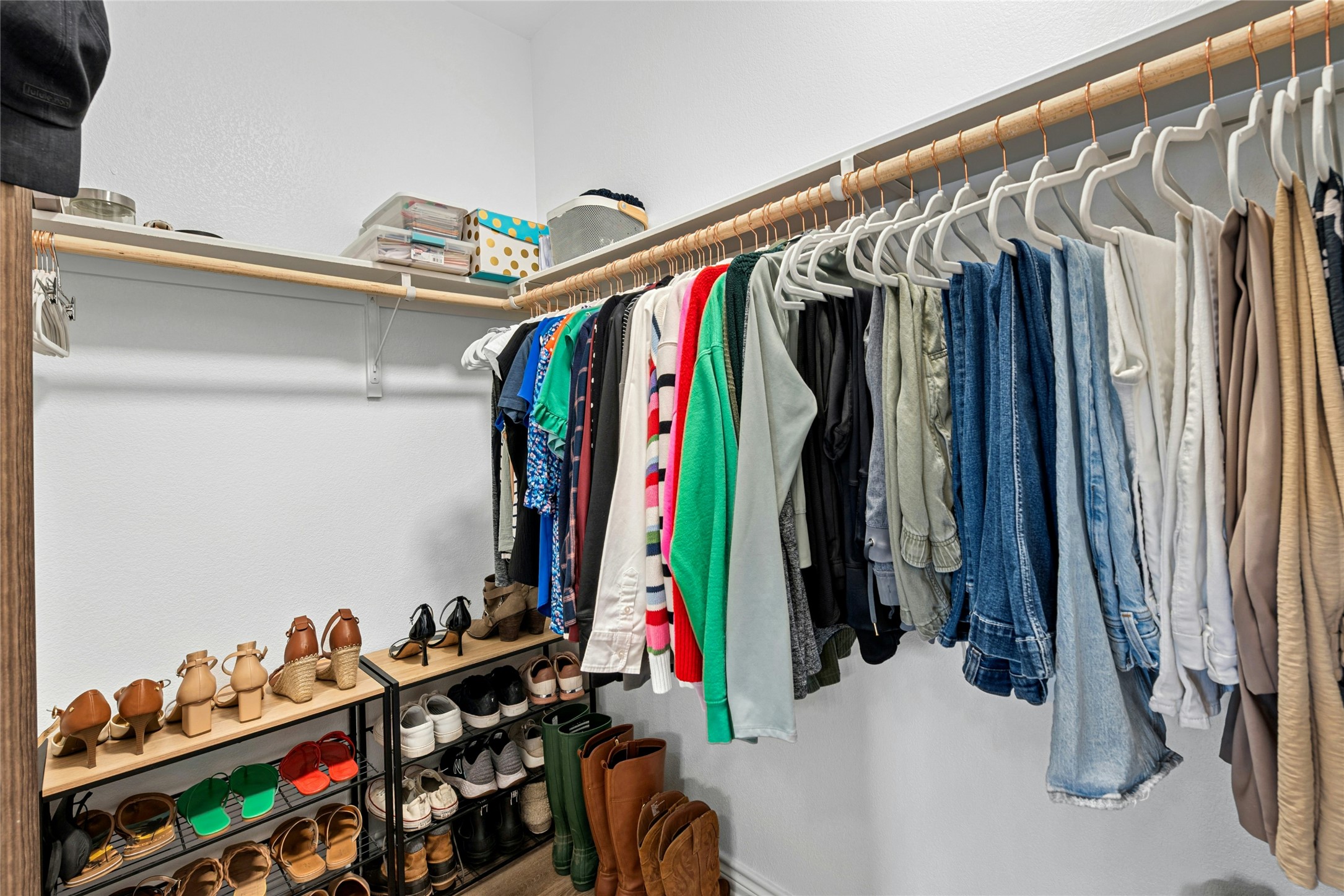 195 Rosebud Ranch Road Bertram, TX 78605 - Photo 27 of 40 a view of walk in closet with clothes and shoes
