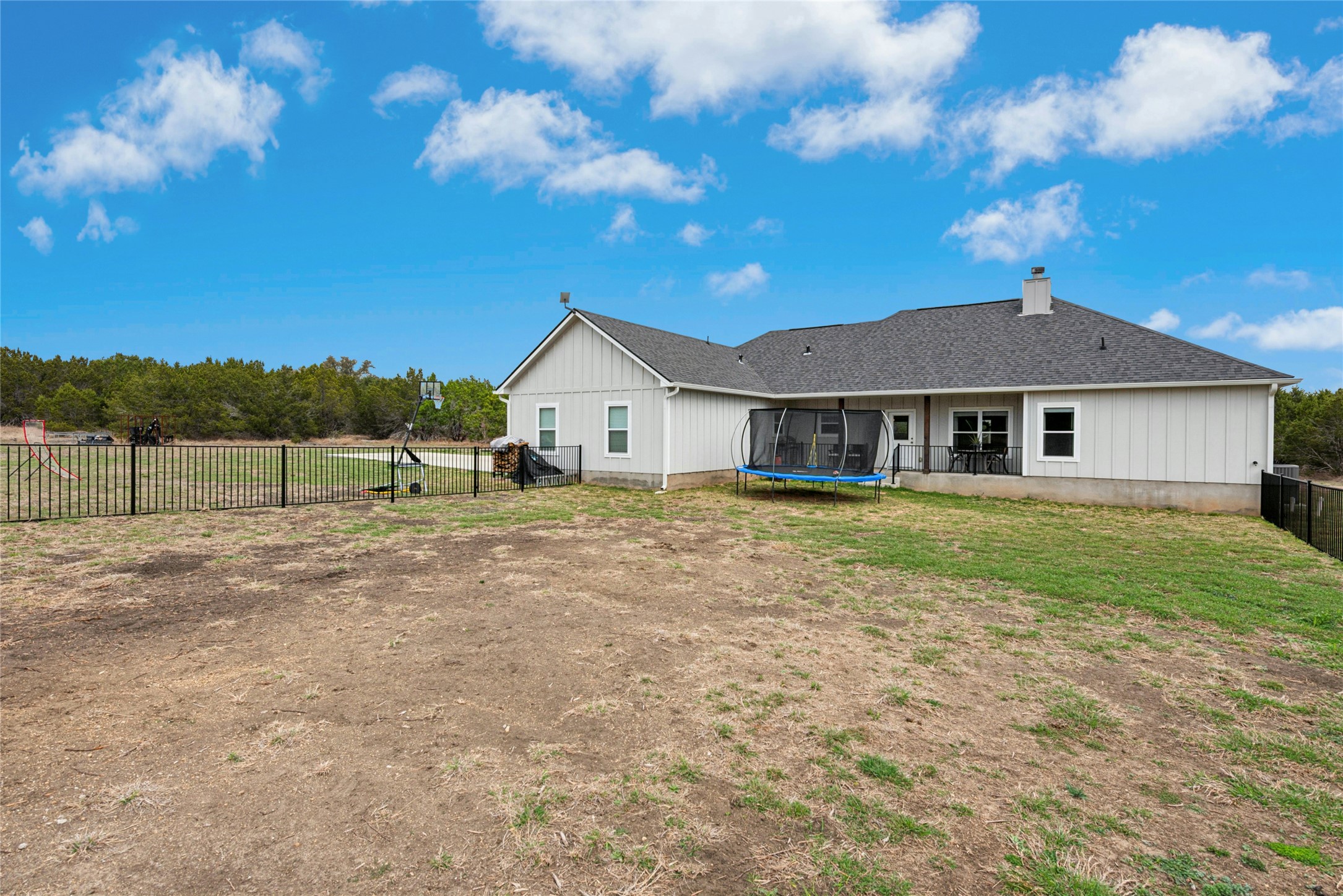 195 Rosebud Ranch Road Bertram, TX 78605 - Photo 35 of 40 a front view of a house with a yard