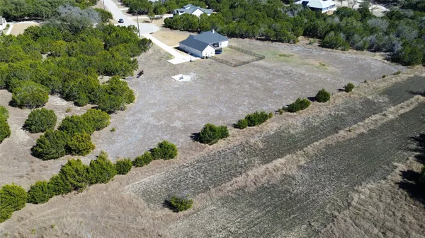 a view of a road with a yard