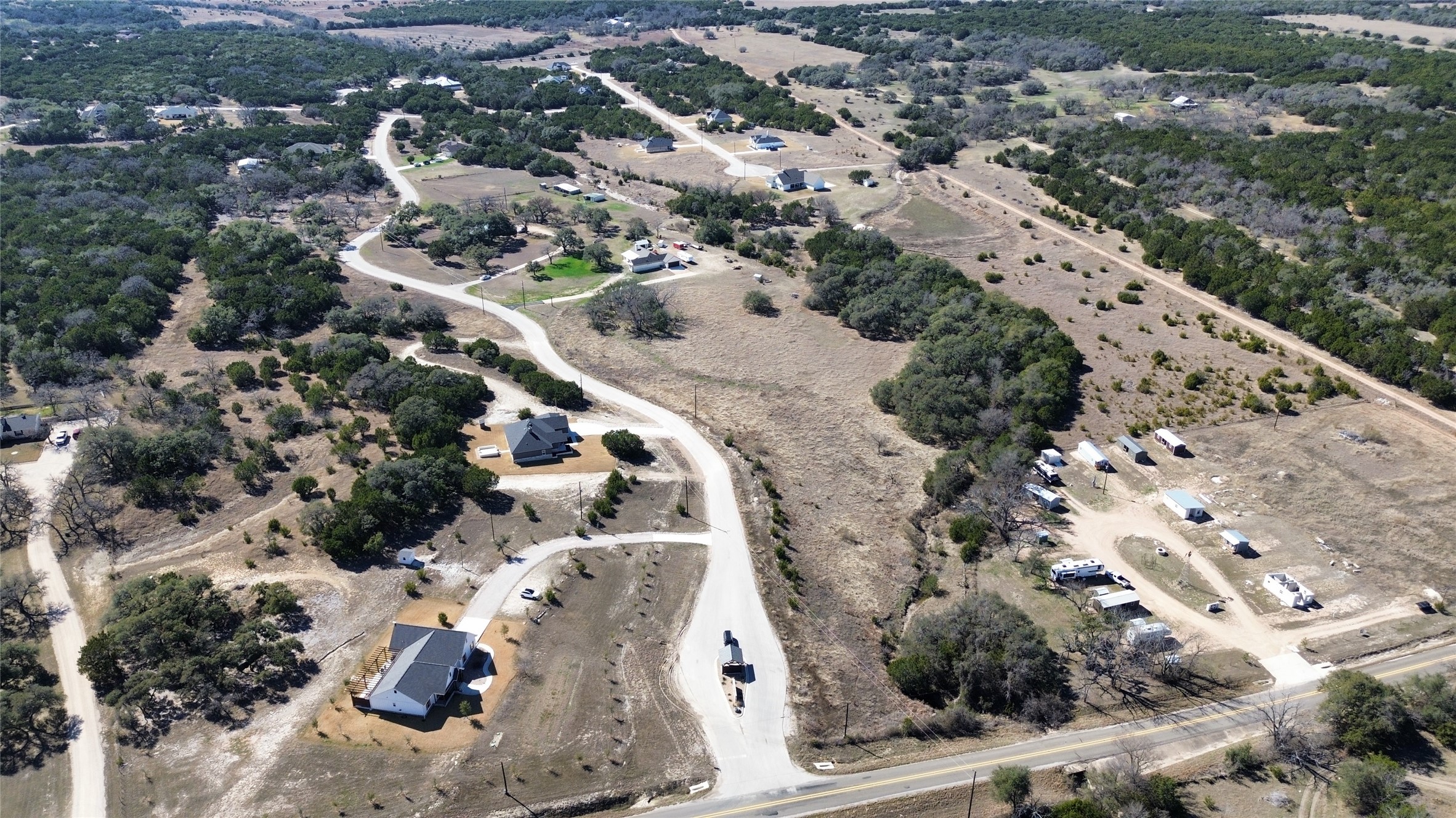 195 Rosebud Ranch Road Bertram, TX 78605 - Photo 39 of 40 an aerial view of house with yard