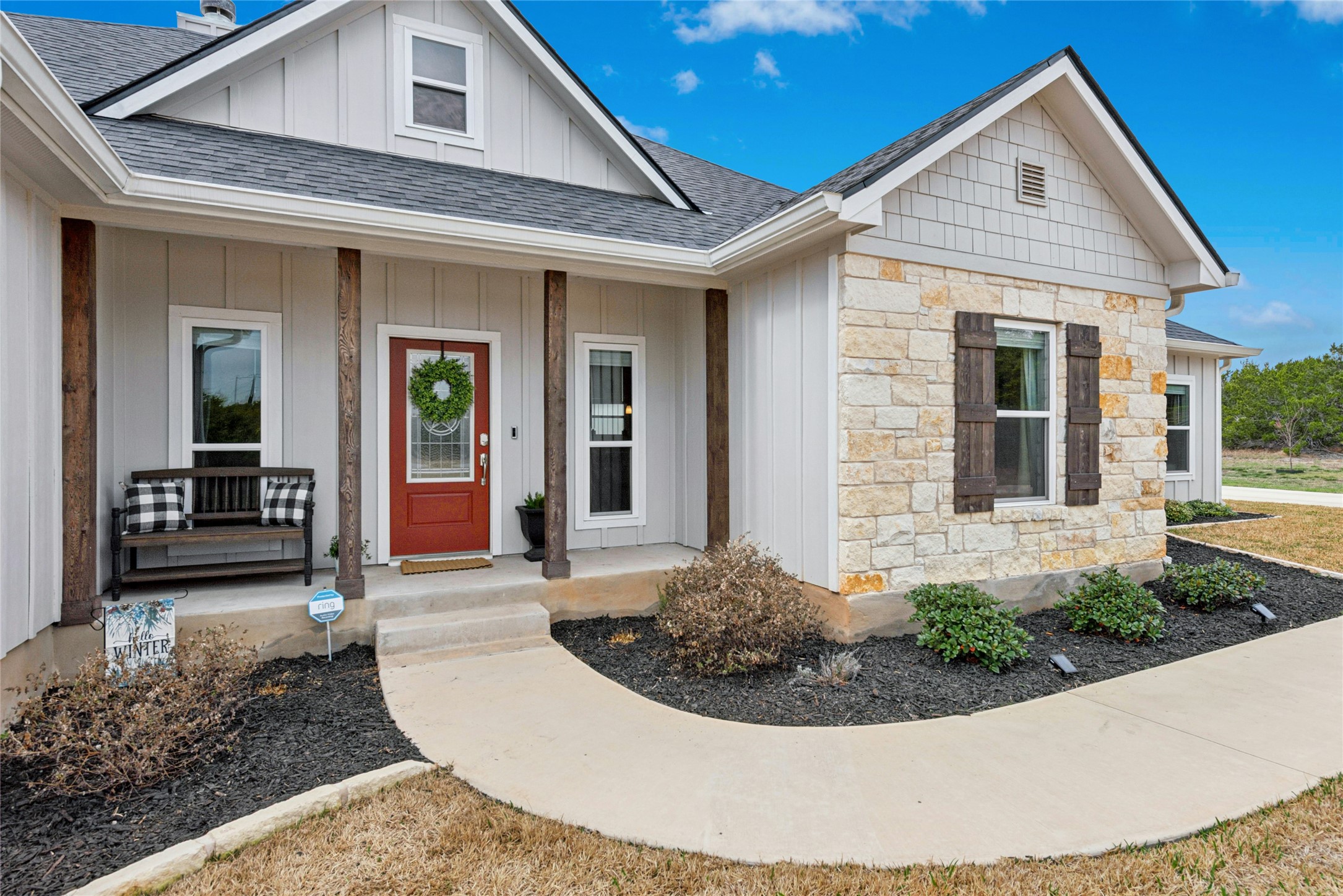 195 Rosebud Ranch Road Bertram, TX 78605 - Photo 4 of 40 a view of a house with more windows and potted plants