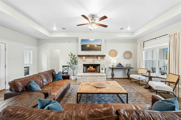 a living room with furniture and a fireplace