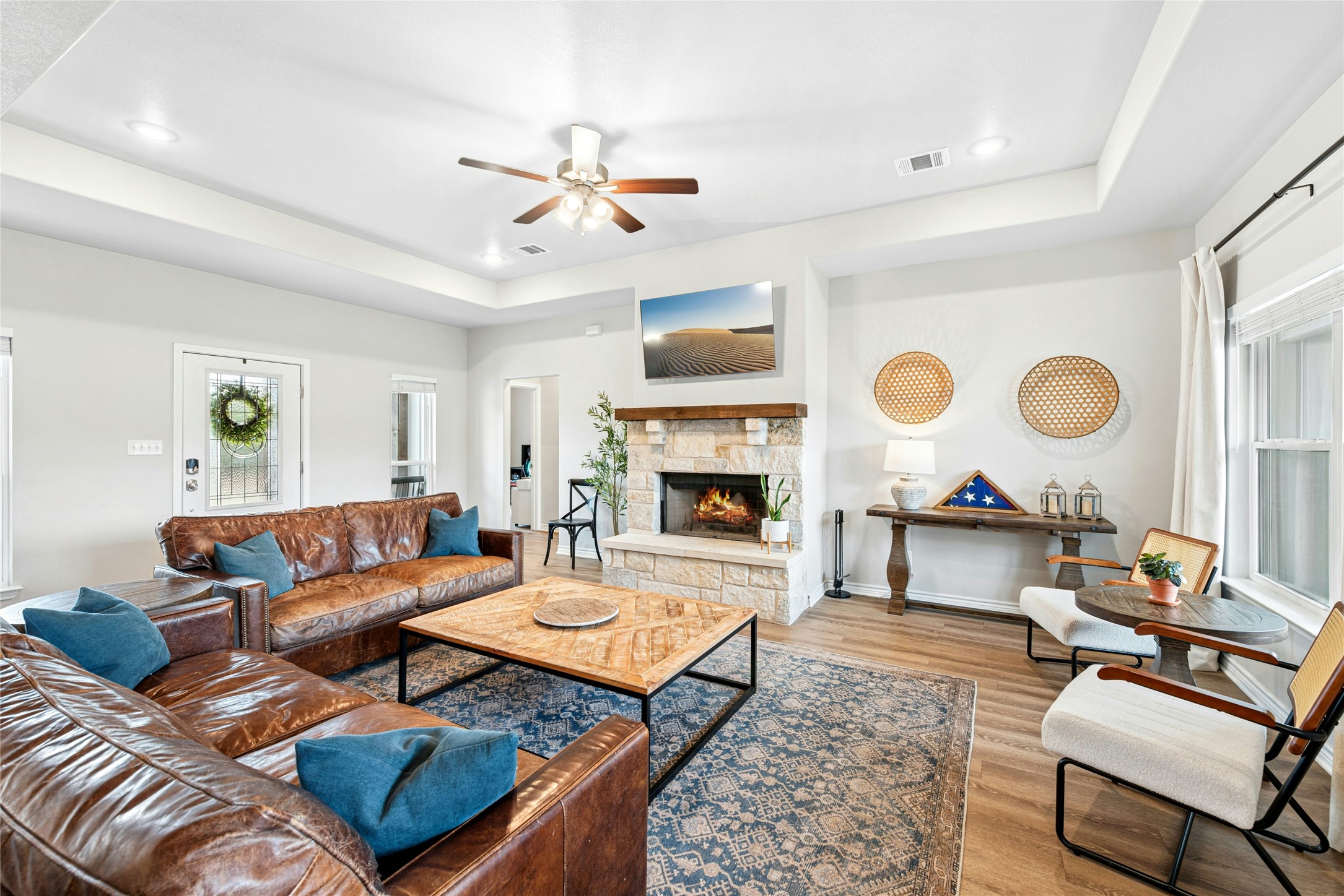 195 Rosebud Ranch Road Bertram, TX 78605 - Photo 10 of 40 a living room with furniture and a fireplace