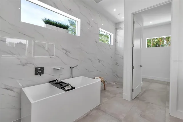 a bathroom with a toilet sink and shower