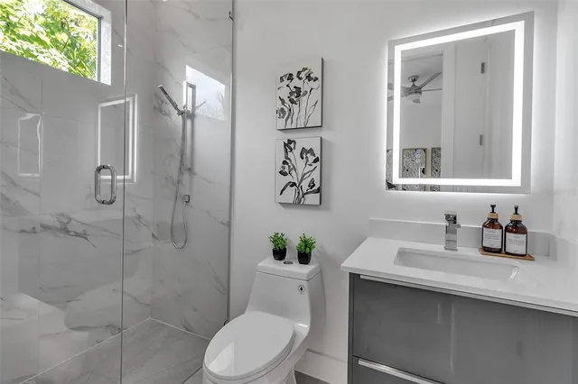 an empty room with closet and a hallway