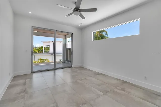 a view of an empty room and glass door