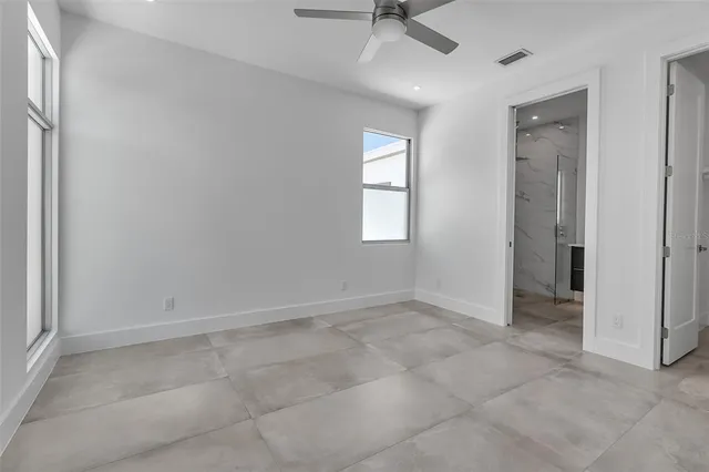 an empty room that has a window in it