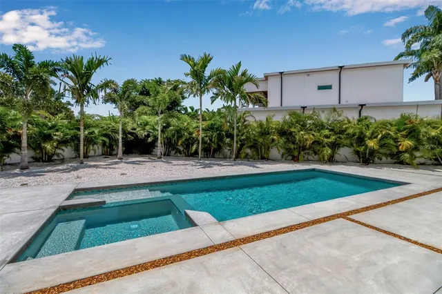 an aerial view of a house with a garden