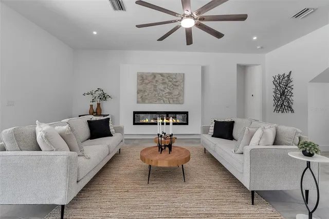 a living room with furniture and a rug