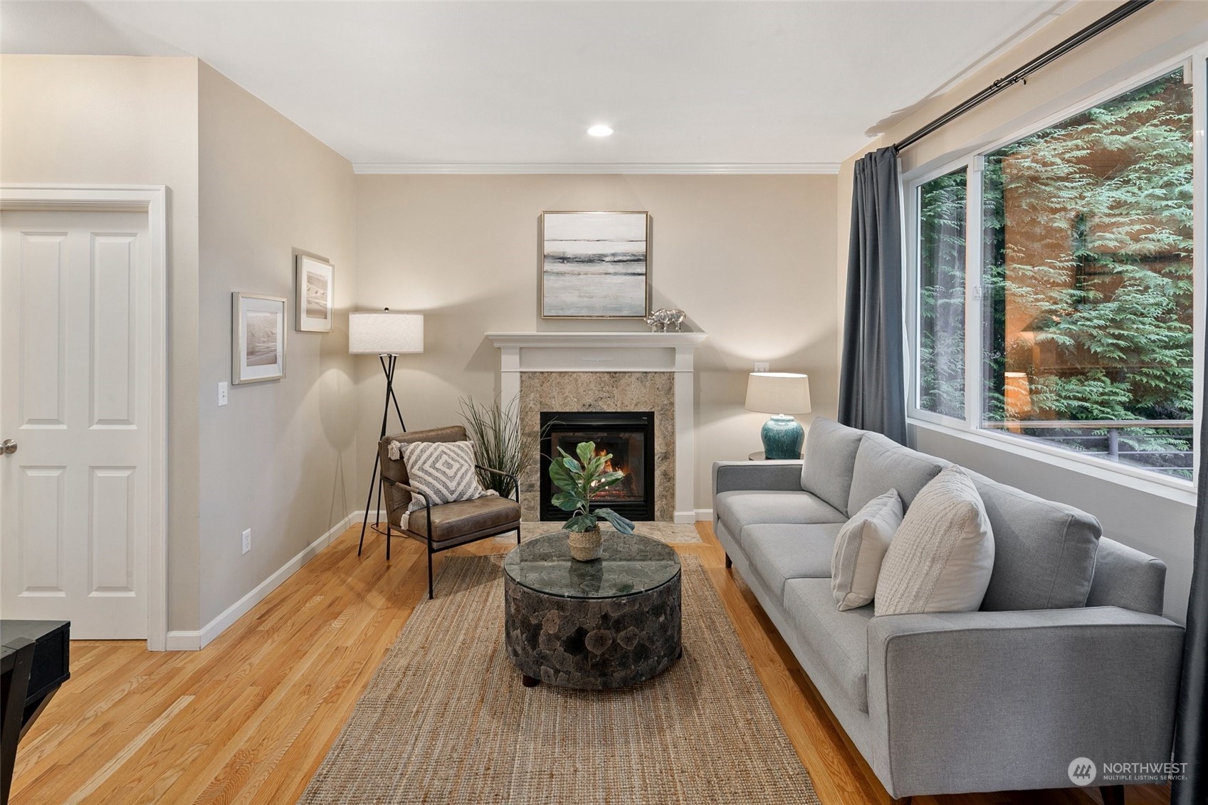 14704 Simonds Road Northeast Bothell, WA 98011 - Photo 11 of 40 a living room with furniture and a fireplace