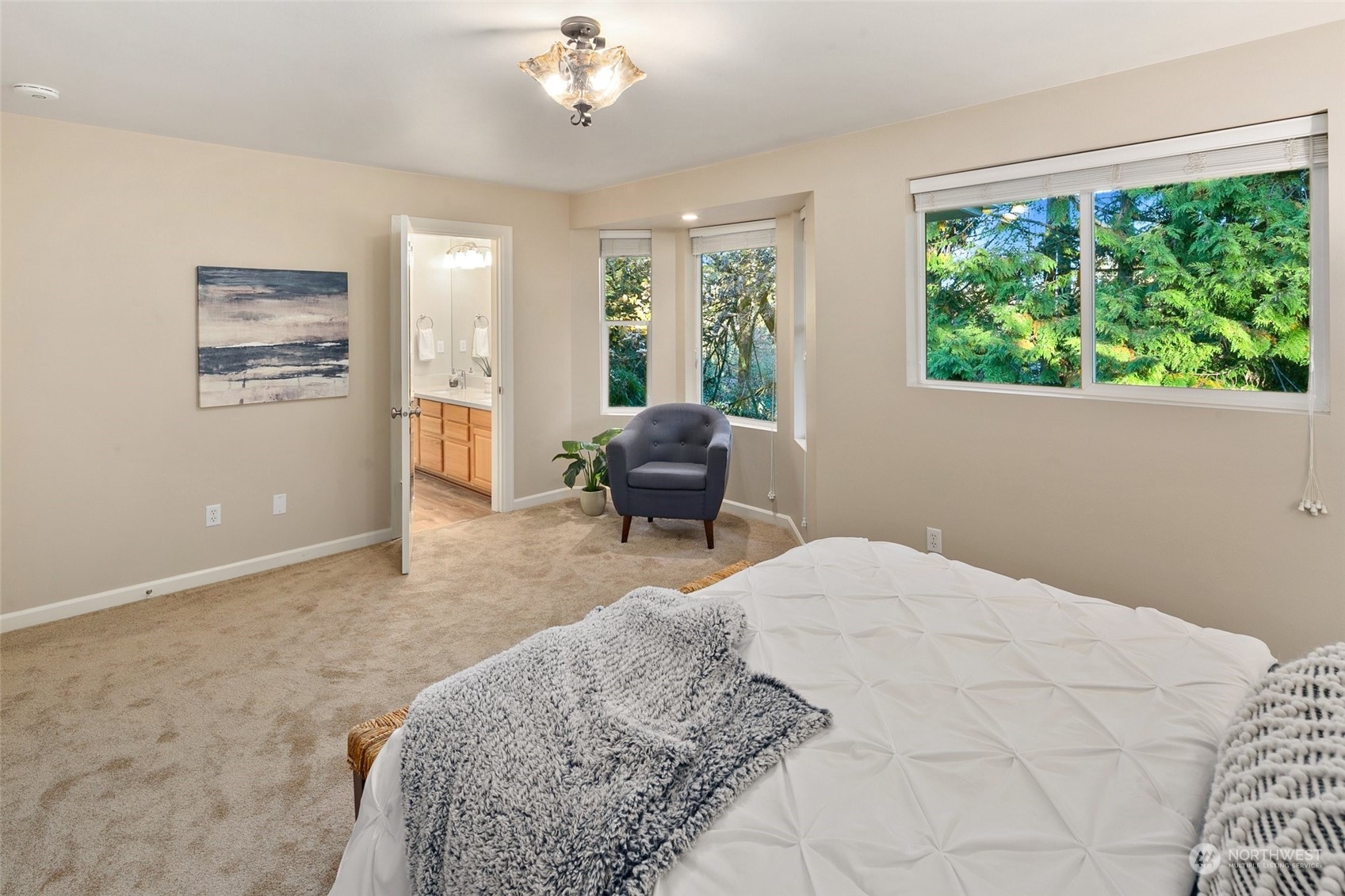 14704 Simonds Road Northeast Bothell, WA 98011 - Photo 19 of 40 a bedroom with a large bed and a window