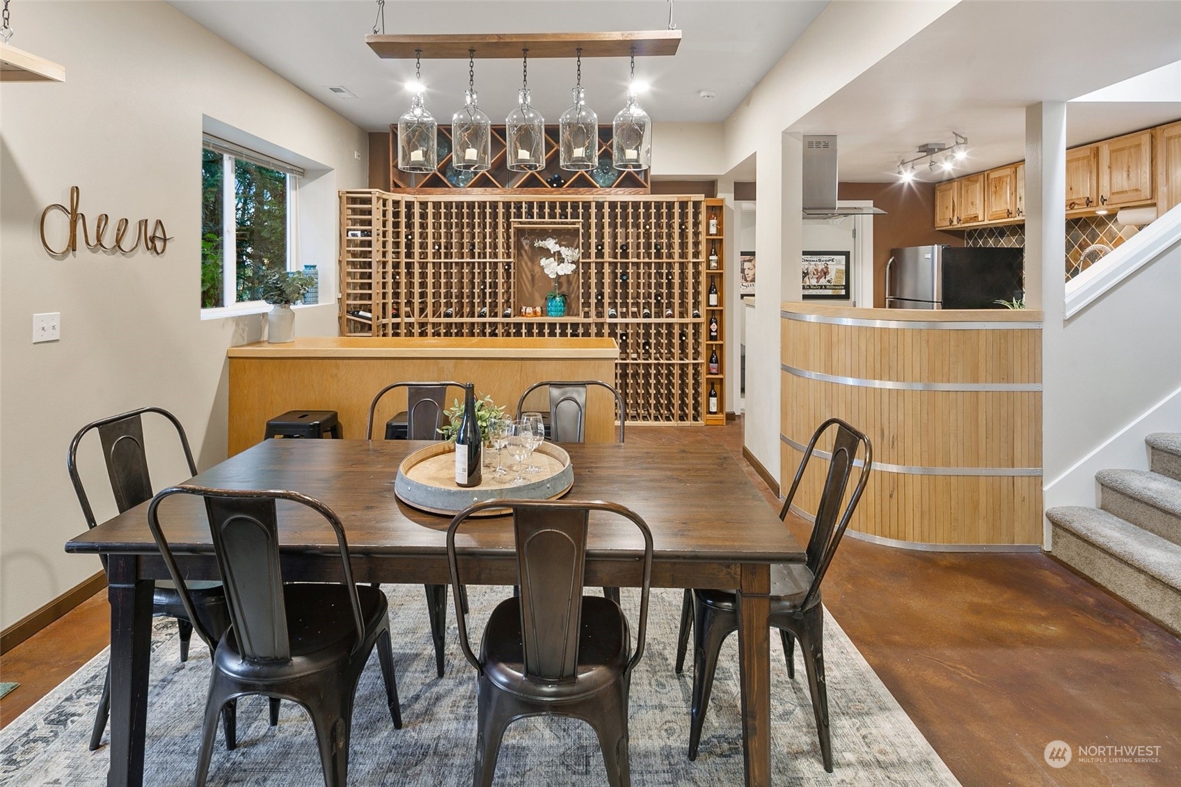 14704 Simonds Road Northeast Bothell, WA 98011 - Photo 27 of 40 a view of a dining room with furniture and chandelier