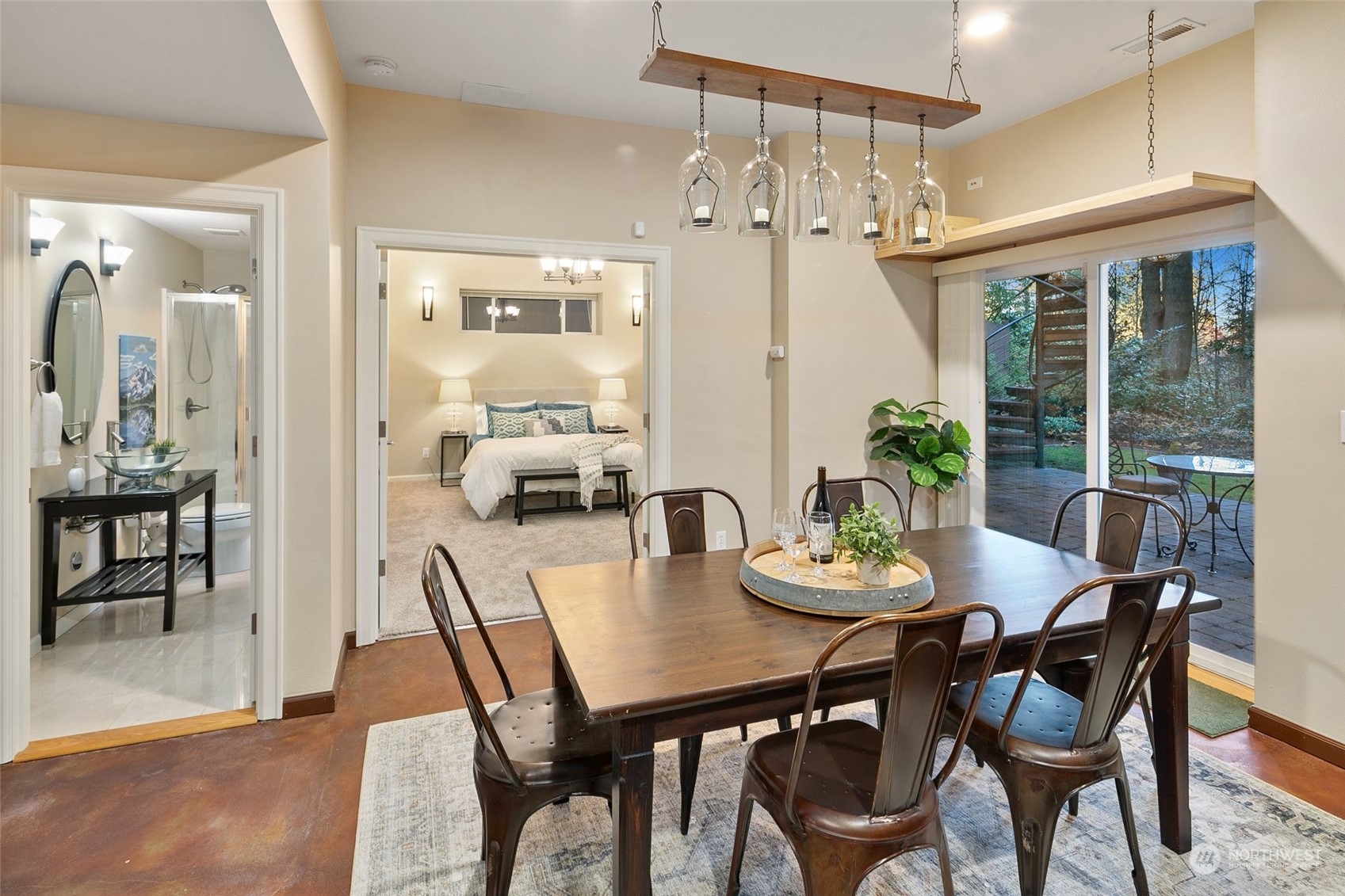 14704 Simonds Road Northeast Bothell, WA 98011 - Photo 29 of 40 a view of a dining room with furniture a chandelier and wooden floor