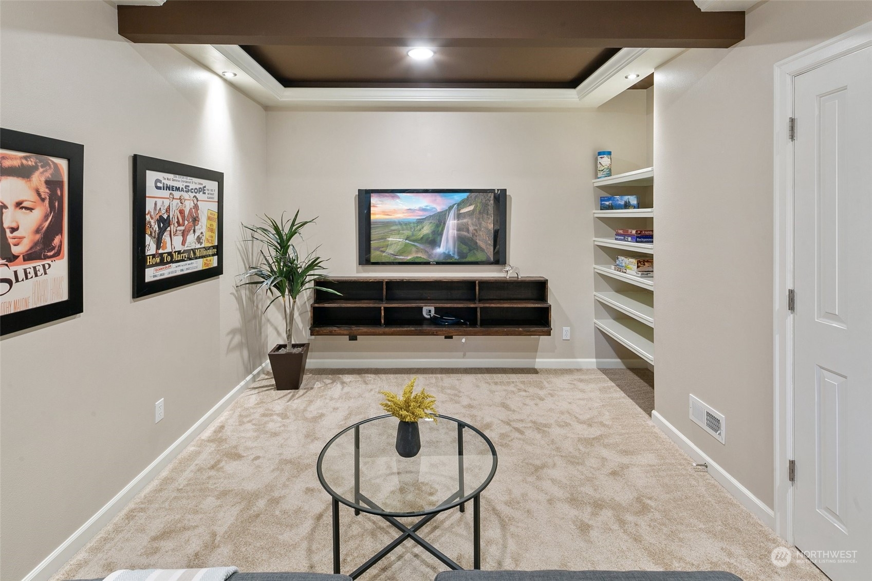 14704 Simonds Road Northeast Bothell, WA 98011 - Photo 33 of 40 a living room with furniture and a flat screen tv
