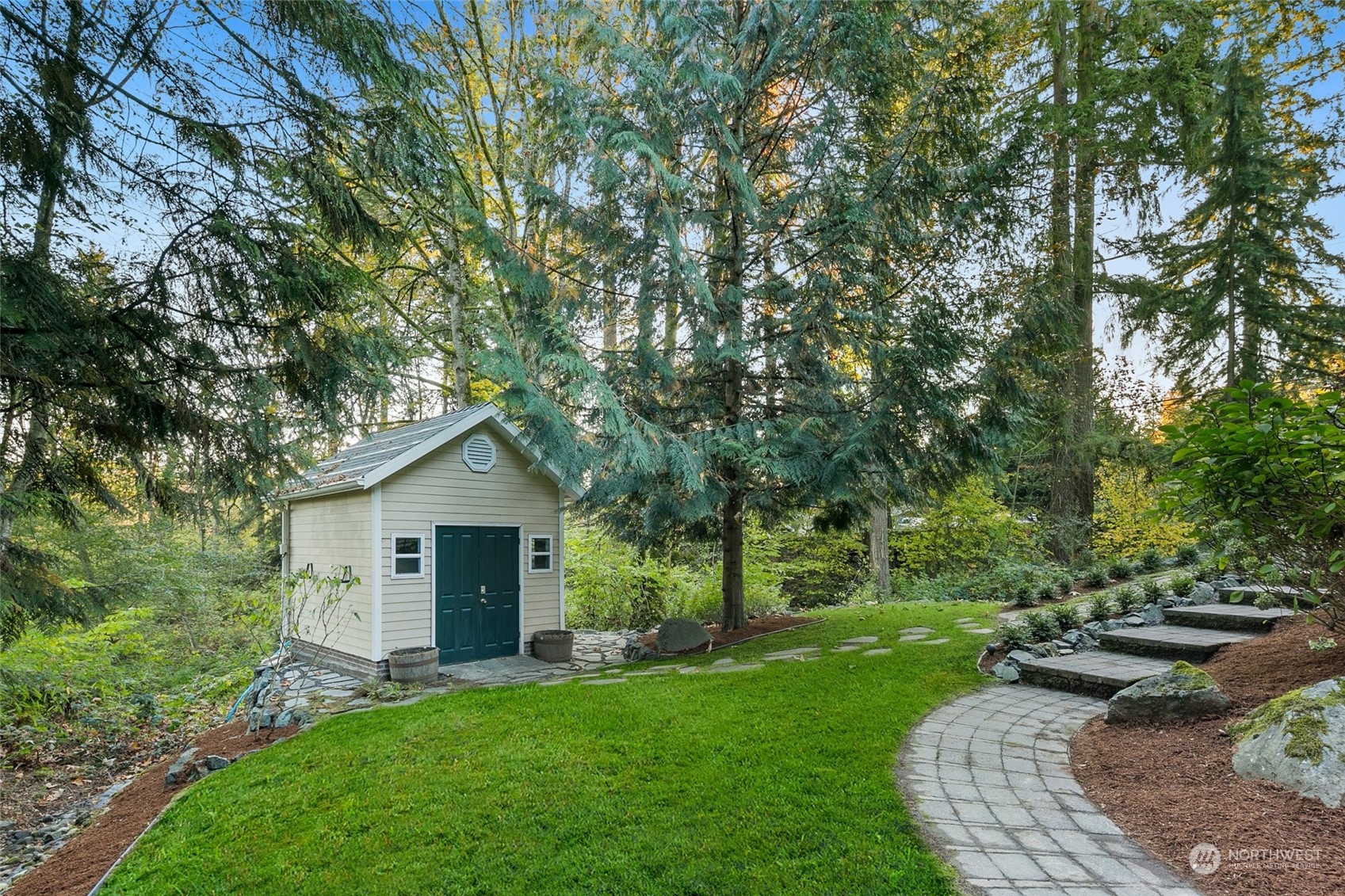 14704 Simonds Road Northeast Bothell, WA 98011 - Photo 36 of 40 a view of a house with a yard and garden