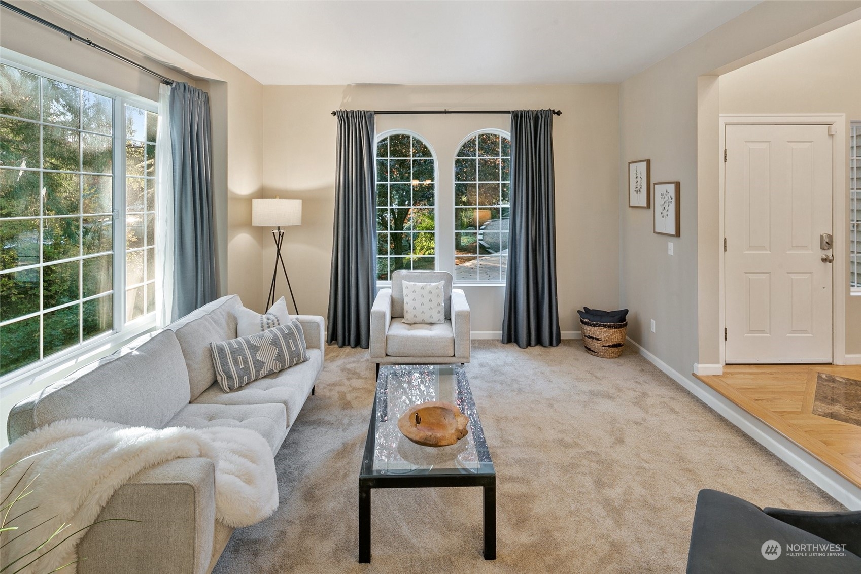 14704 Simonds Road Northeast Bothell, WA 98011 - Photo 4 of 40 a living room with furniture and a floor to ceiling window