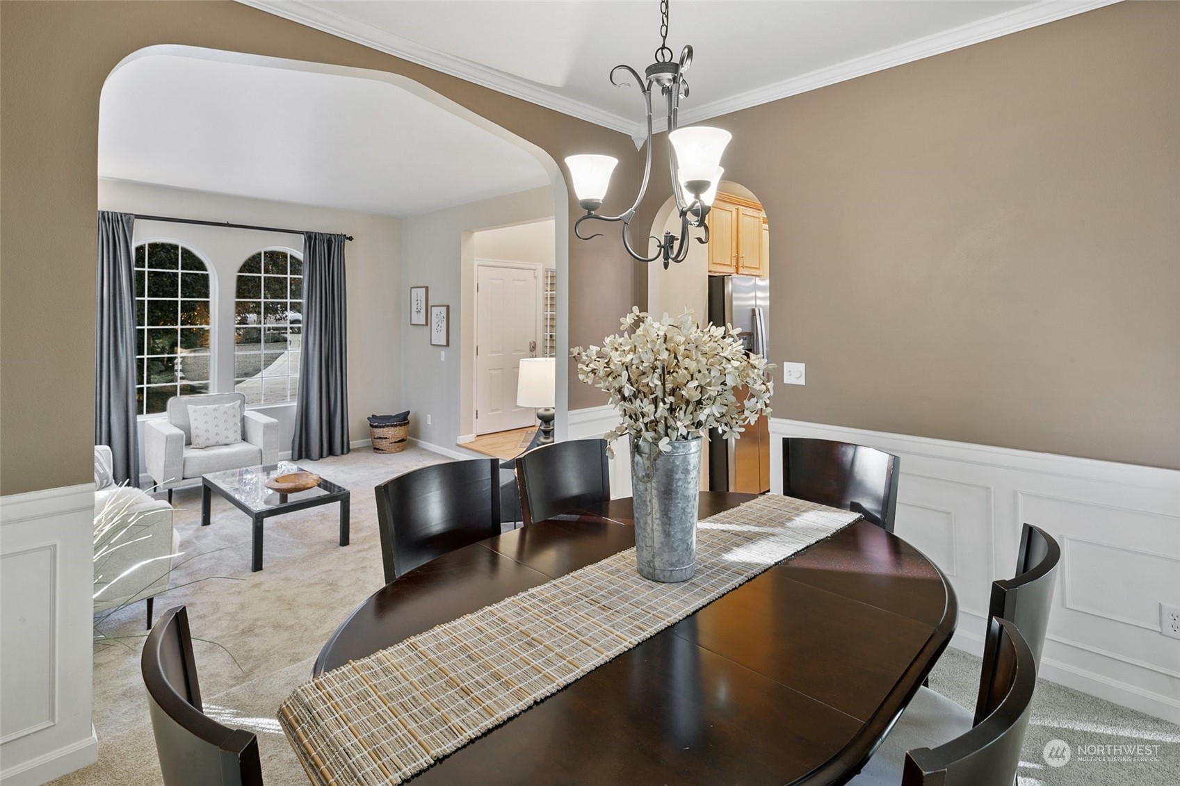 14704 Simonds Road Northeast Bothell, WA 98011 - Photo 6 of 40 a view of a dining room with furniture and chandelier