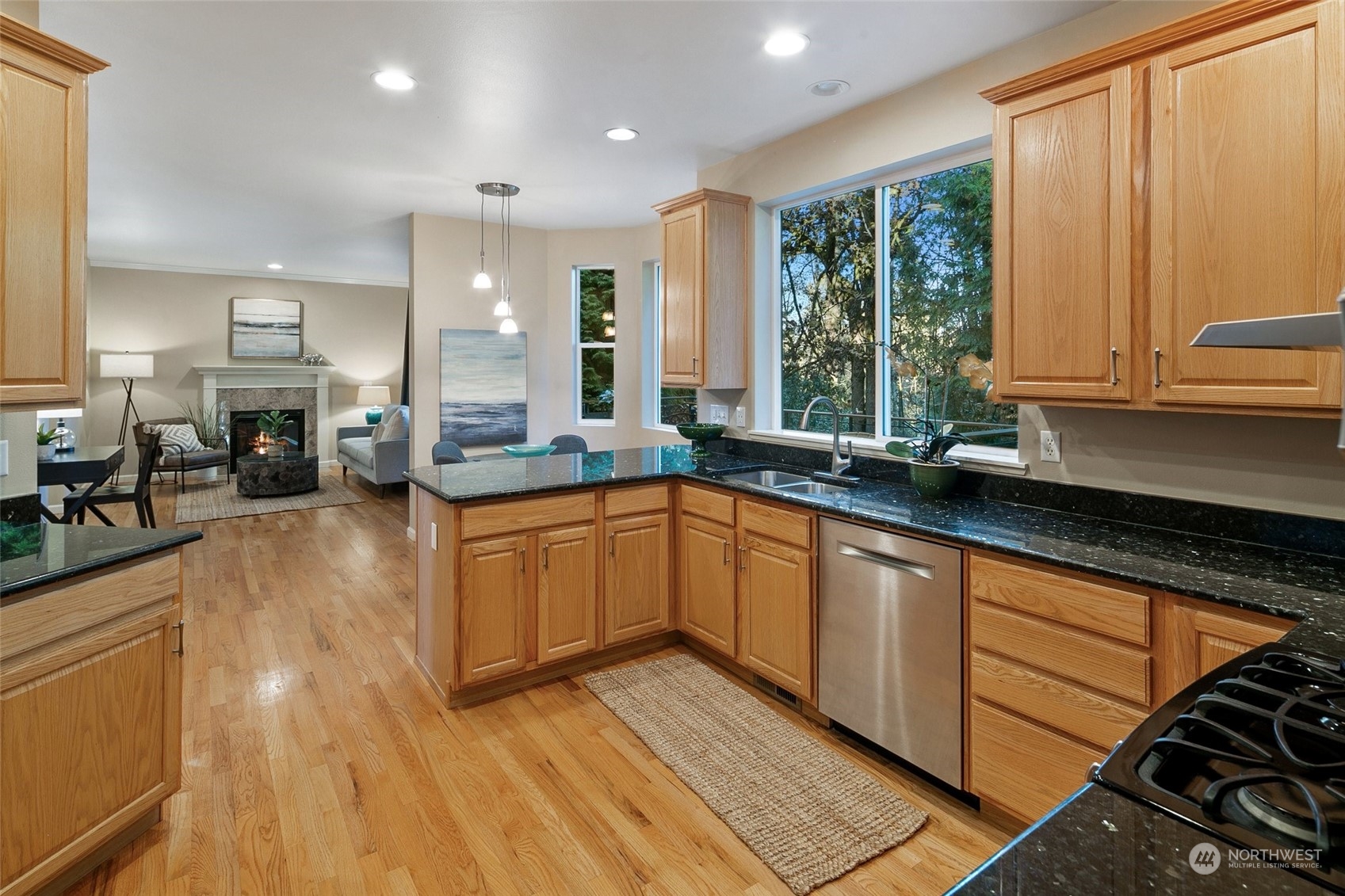 14704 Simonds Road Northeast Bothell, WA 98011 - Photo 7 of 40 a kitchen with wooden floors and sink