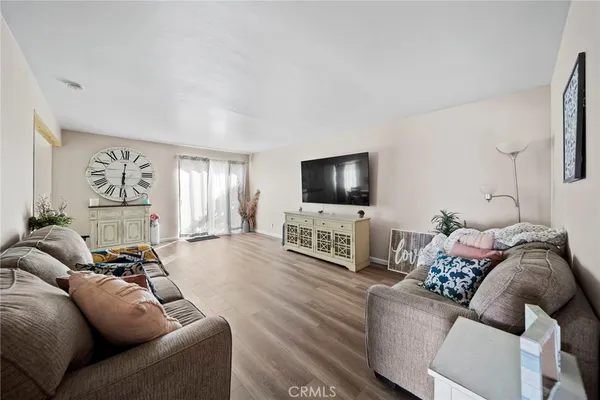 a kitchen with stainless steel appliances granite countertop a refrigerator sink and stove