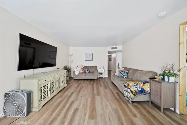 a living room with furniture and a table