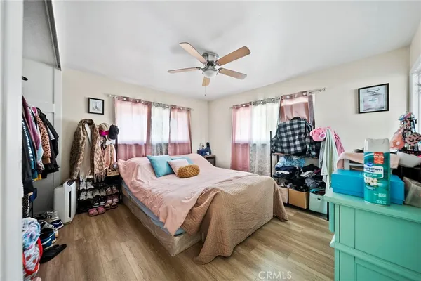 a bed room with a bed and a window