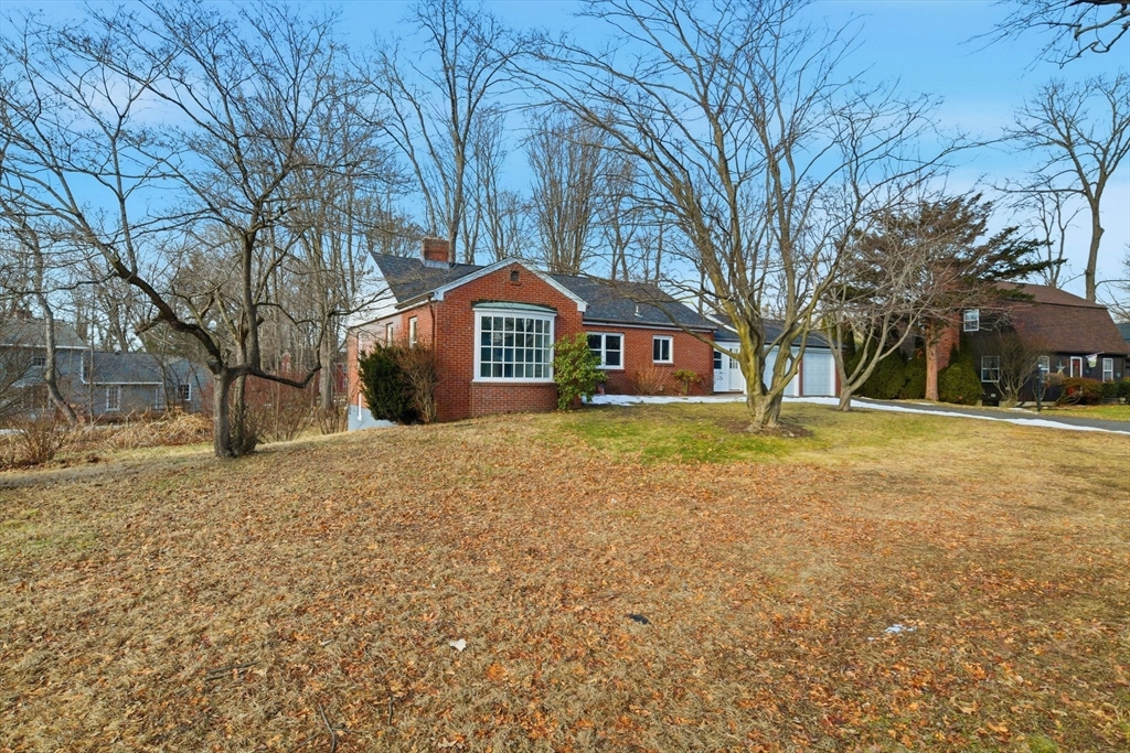 259 Ohio Avenue West Springfield, MA 01089 - Photo 3 of 30 a front view of a house with a yard and large trees