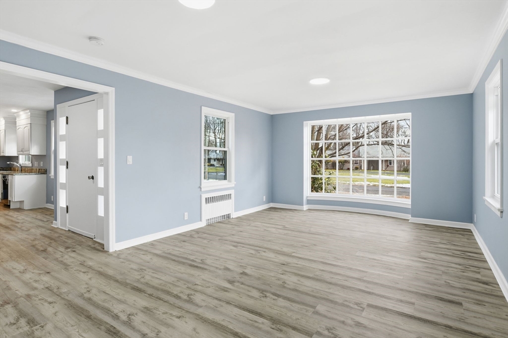 259 Ohio Avenue West Springfield, MA 01089 - Photo 6 of 30 a view of an empty room with wooden floor and a window