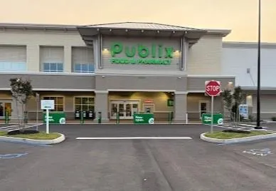 a view of a brick building with potted plants