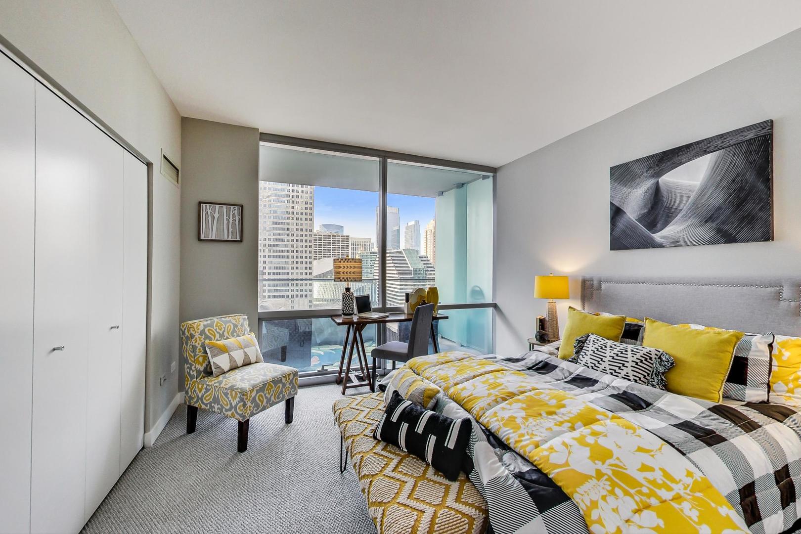 8 East Randolph Street, Unit 2207 Chicago, IL 60601 - Photo 15 of 29 a bed room with a bed and a chair