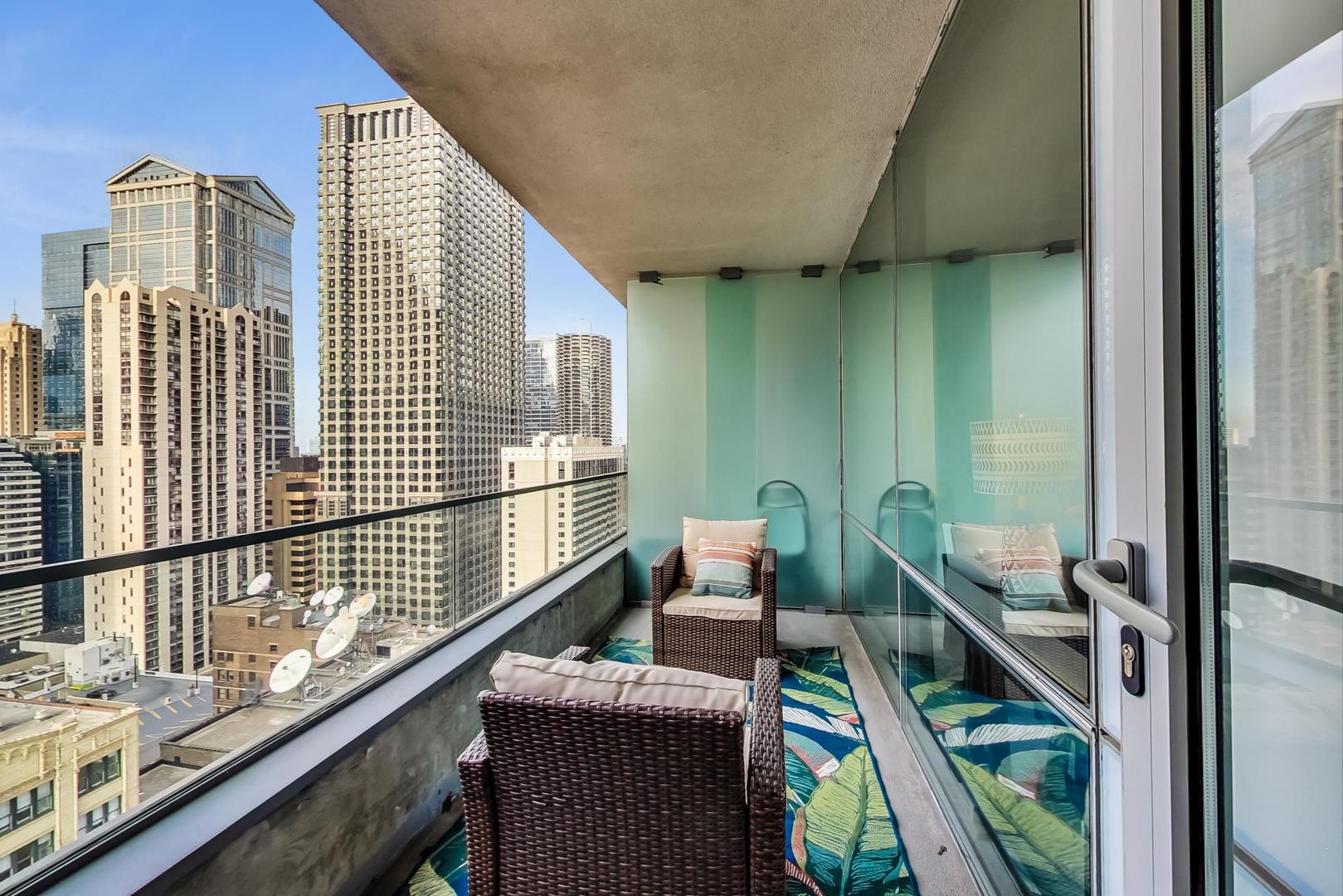 8 East Randolph Street, Unit 2207 Chicago, IL 60601 - Photo 21 of 29 a balcony view with couple of chairs