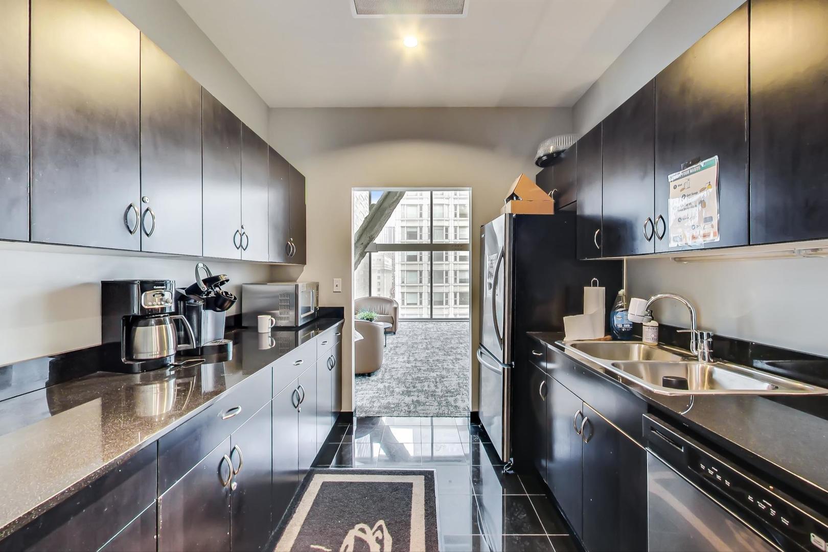 8 East Randolph Street, Unit 2207 Chicago, IL 60601 - Photo 25 of 29 a kitchen with granite countertop lots of counter top space and stainless steel appliances