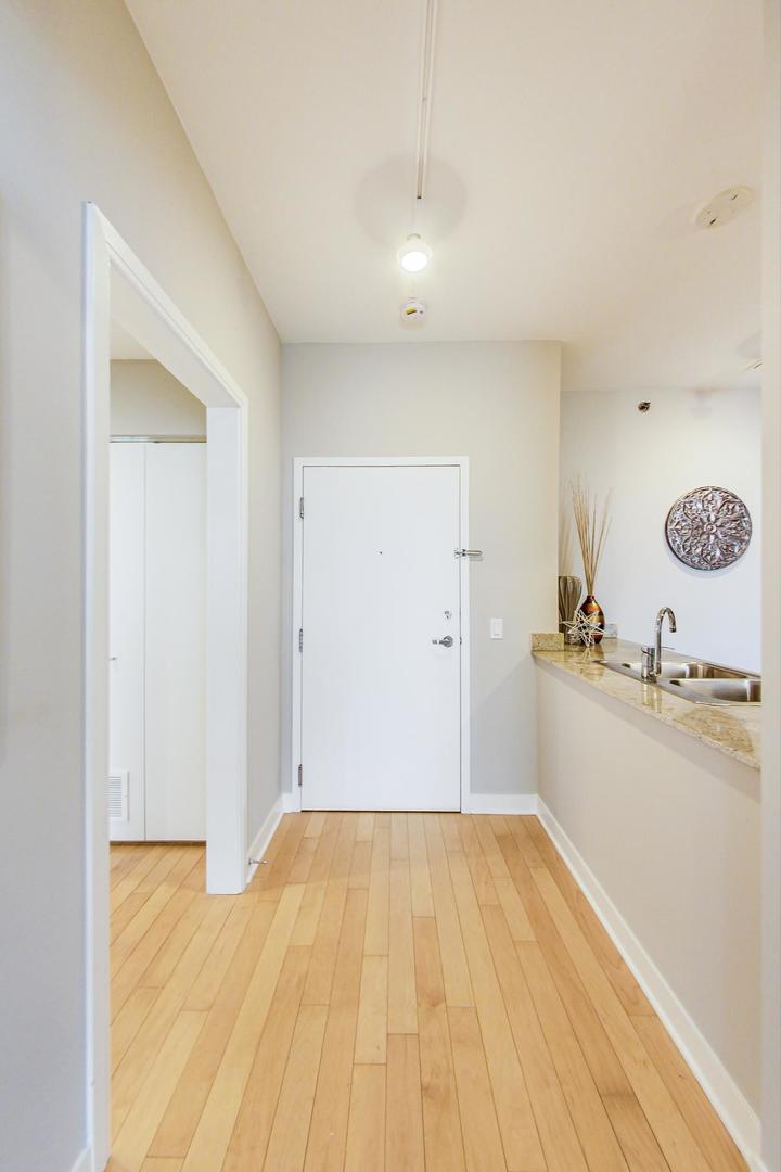 8 East Randolph Street, Unit 2207 Chicago, IL 60601 - Photo 3 of 29 a bathroom with a sink and a mirror