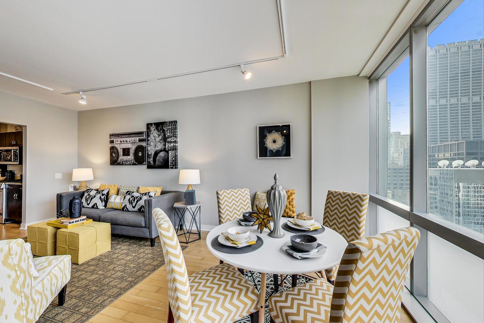 8 East Randolph Street, Unit 2207 Chicago, IL 60601 - Photo 8 of 29 a living room with furniture and wooden floor