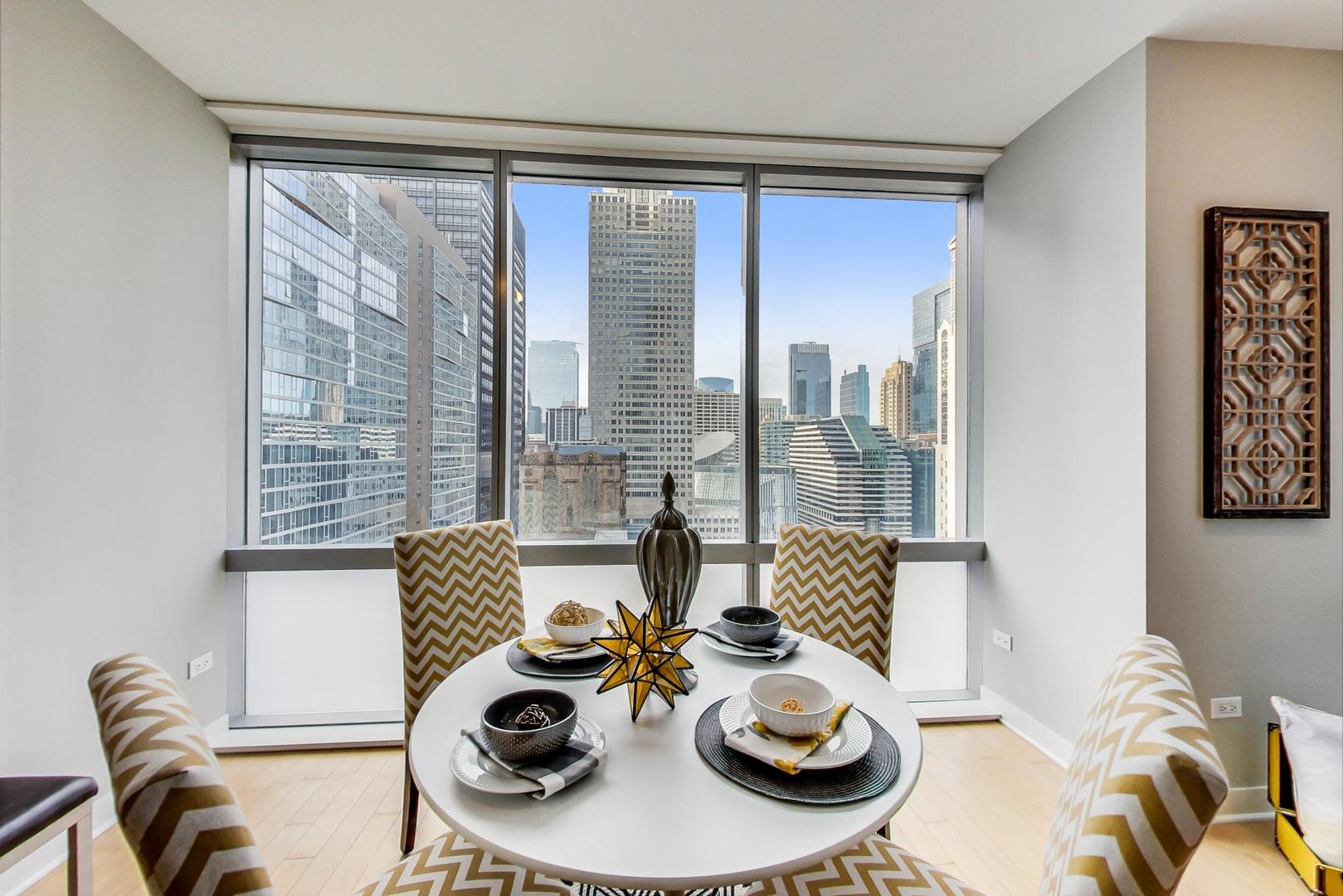 8 East Randolph Street, Unit 2207 Chicago, IL 60601 - Photo 10 of 29 a living room with furniture and wooden floor