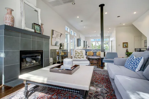 a living room with furniture and a fireplace