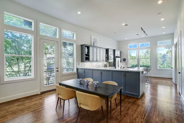 a dining room with furniture window wooden floor