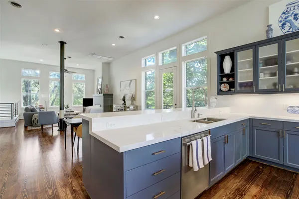 a kitchen with a stove a sink and a refrigerator