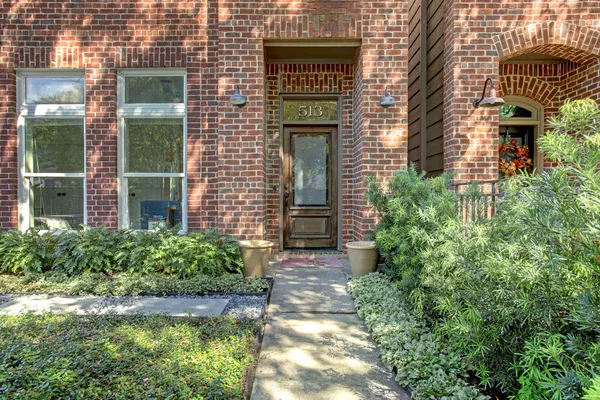 a view of a pathway both side of the house