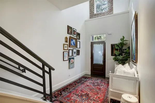 a view of entryway with stairs and wooden floor