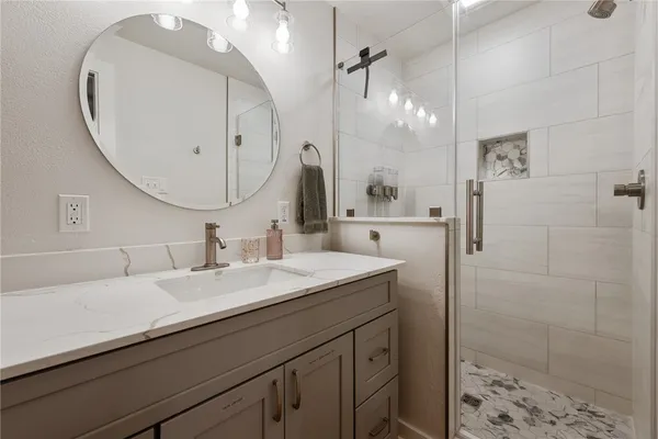 a bathroom with a sink and a mirror