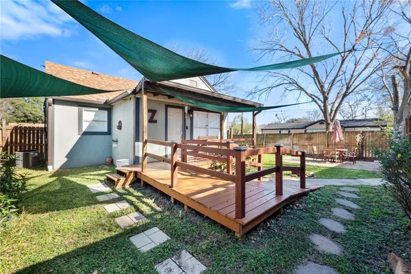 a view of a backyard with sitting area
