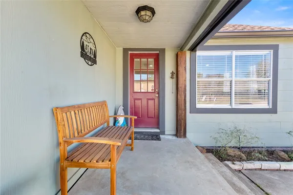 a bench sitting in front of a building