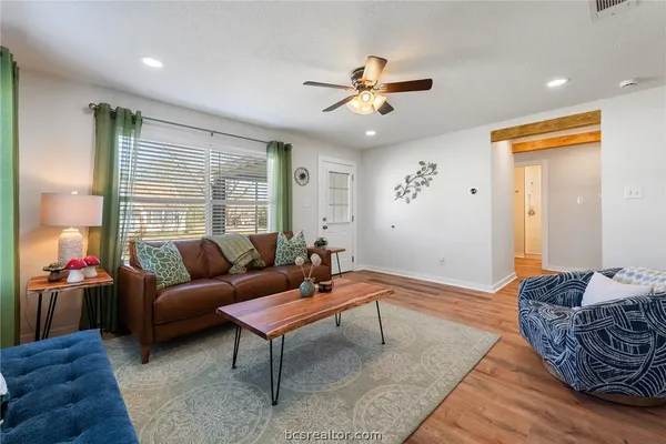 a living room with furniture and a large window