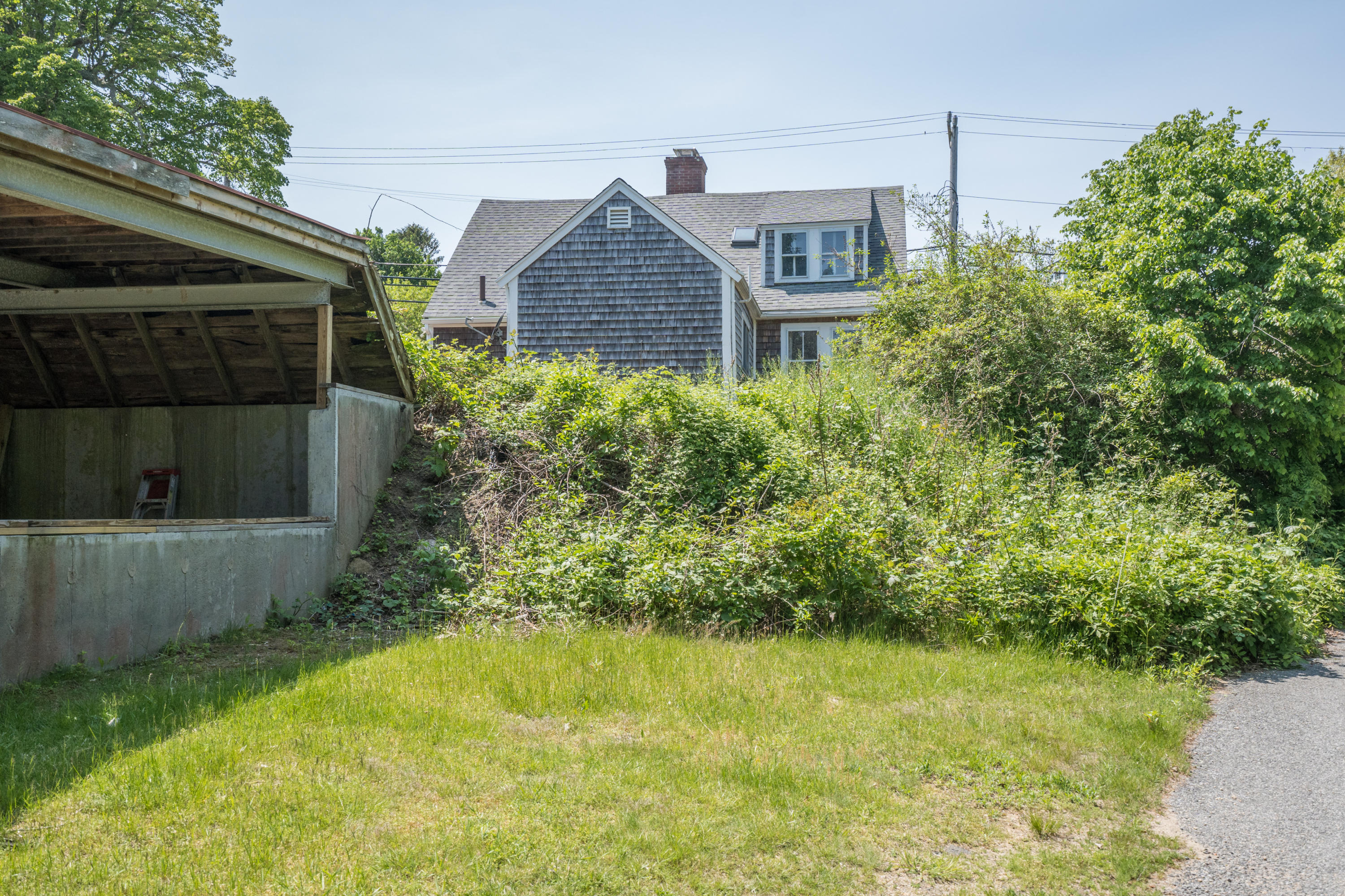 337 South Main Street Centerville, MA 02632 - Photo 14 of 19 a front view of a house with a yard