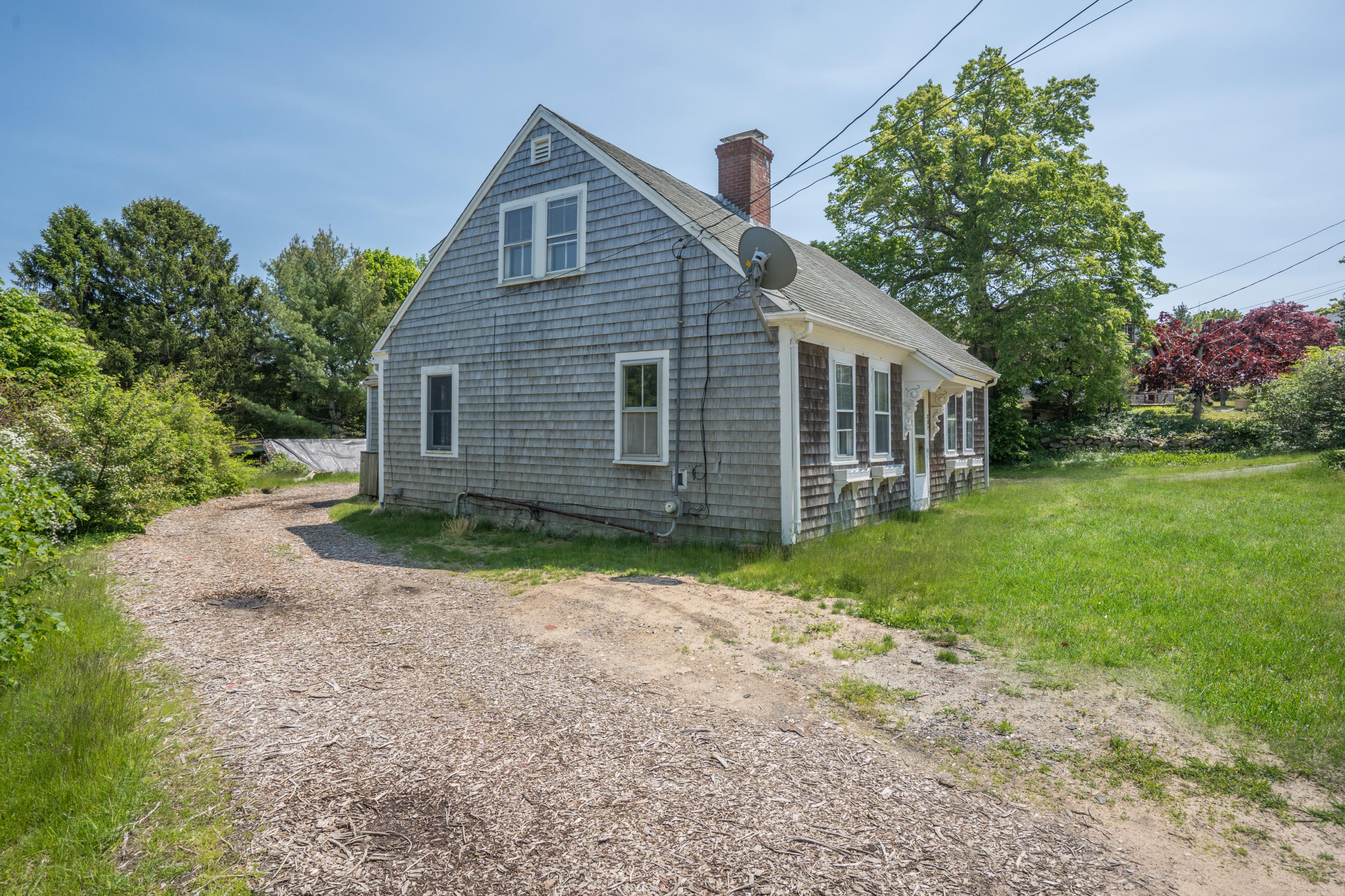 337 South Main Street Centerville, MA 02632 - Photo 18 of 19 a front view of a house with a yard